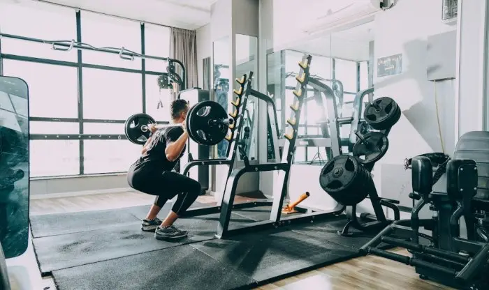 Person training with weights in a gym