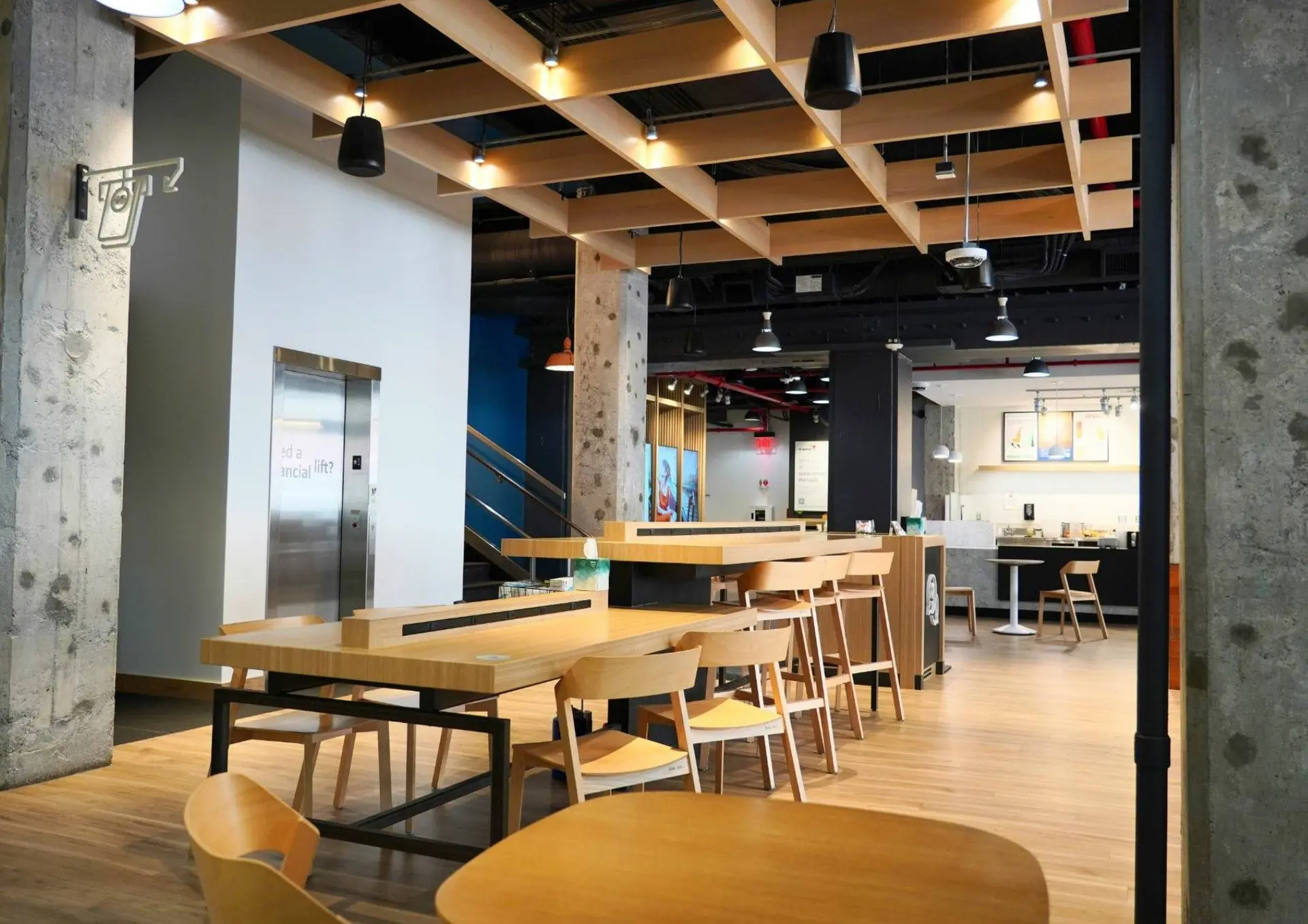 Coworking space with shared tables and pendant lights