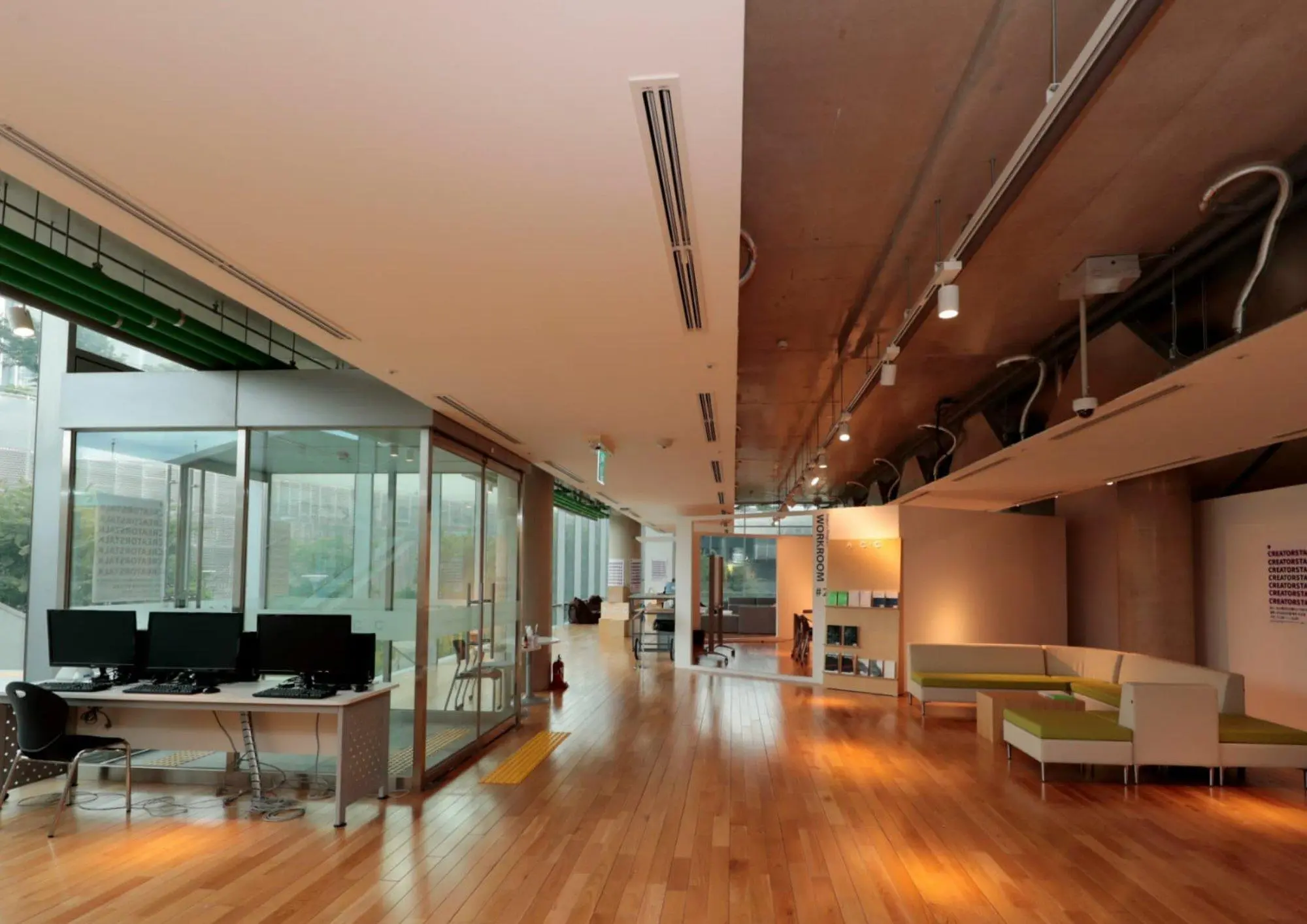 Coworking space with workstations and a lounge area